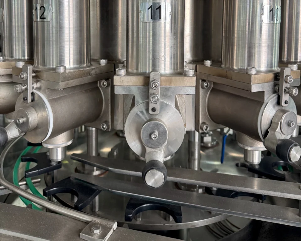 Piston filling machine metering cylinders and valve bodies close-up